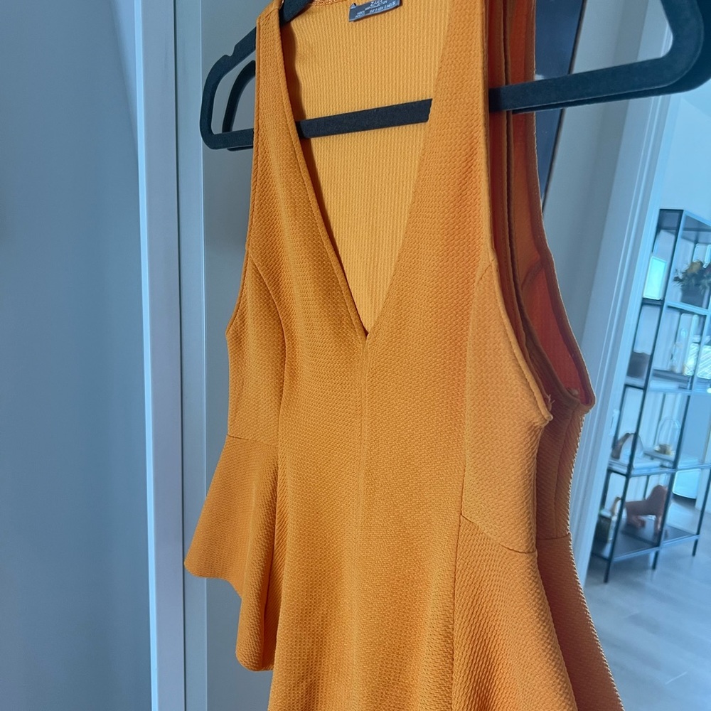 Peplum - Picture 3 of 3